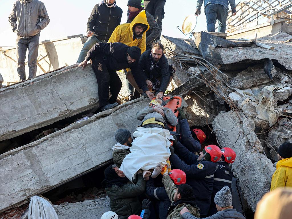 Rescue workers pull out a survivor from the rubble of a destroyed building in Kahramanmaras, southern Turkey. Picture: AFP