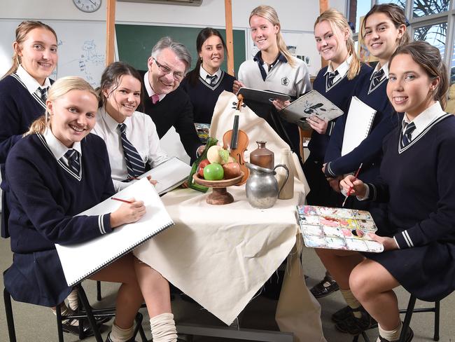 Head of Arts, David Morrison with Year 11  students, Claire, Ava, Milly, Tilly, Charlie, Charlotte, Bella and Lucy. Lauriston Girls school has among the lowest student to teacher ratio's in the state. Data also shows independent schools have the best ratios of all schools in Victoria. Laurison's average class size was just eight girls to every teacher. Picture: Tony Gough