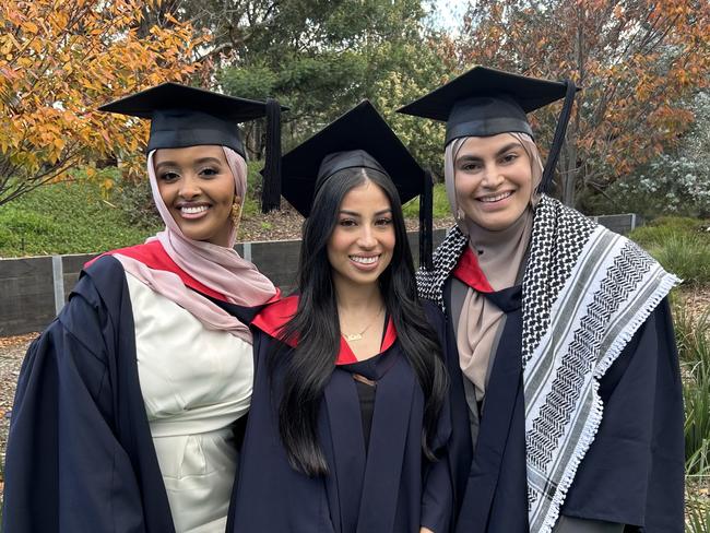 Seham Abdi, Camila Cardenas and Ruqayyah Mohamad graduate with Bachelors of Midwifery from La Trobe University on May 14, 2024. Picture: Brittany Busch