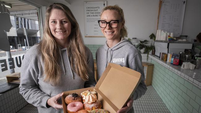 Queens Fine Pastry manager Danica Barwick and front of house manager Lily Frankham with a selection of doughnuts at Hobart. Picture: Chris Kidd