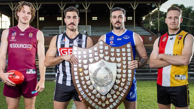 Adelaide Footy League captains Lochie Charlton (PAC), Jon Giannini (PNU), Jesse O'Brien (SPOC) and Lou Whitlelock (Goodwood Saints) with the division one premiership shield before last season’s finals. Whitlock’s Saints fell short against PNU and are looking to bounce back next year. Picture: Mark Brake