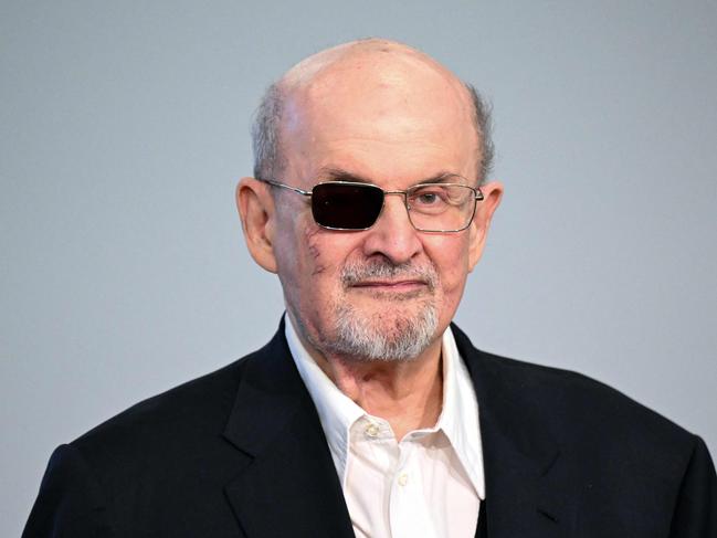 (FILES) (FILES) British-US author Salman Rushdie poses for photographers as he arrives to address a press conference at The Frankfurt Book Fair in Frankfurt am Main, western Germany on October 20, 2023. British-American author Salman Rushdie recounts the near-fatal stabbing at a public event in 2022 that left him blind in one eye and his journey to healing in his new memoir "Knife," which hits stores Tuesday. (Photo by Kirill KUDRYAVTSEV / AFP)