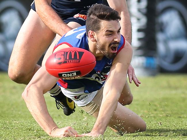 SANFL: Central District v South Adelaide at Elizabeth Oval. Central's John Butcher wins a free for a push in the back by his South Adelaide opponent, Bradley Crabb.  23 June 2018. (AAP Image/Dean Martin)