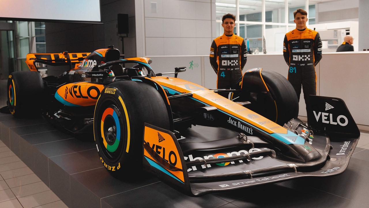 A handout picture released on February 13, 2023 by McLaren shows British driver Lando Norris (L) and McLaren's Australian driver Oscar Piastri posing beside the McLaren MCL60 Formula One racing car for the 2023 season at their base in Woking, west of London. (Photo by McLAREN / AFP) / RESTRICTED TO EDITORIAL USE - MANDATORY CREDIT "AFP PHOTO / MCLAREN" - NO MARKETING NO ADVERTISING CAMPAIGNS - DISTRIBUTED AS A SERVICE TO CLIENTS