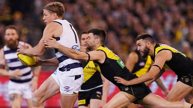 Trent Cotchin tackles Rhys Stanley. Picture: AAP