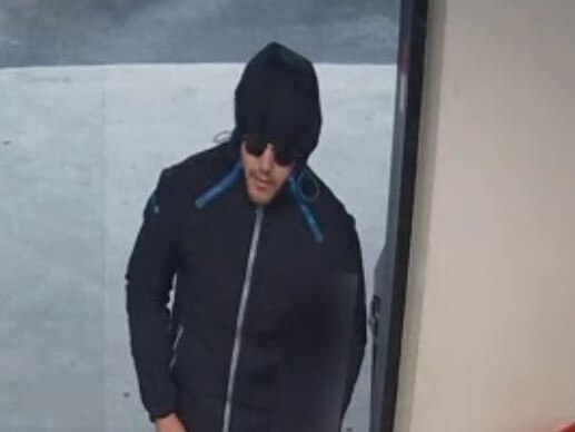 Police would like to speak to a man following an armed robbery at a Kew service station on March 25.
