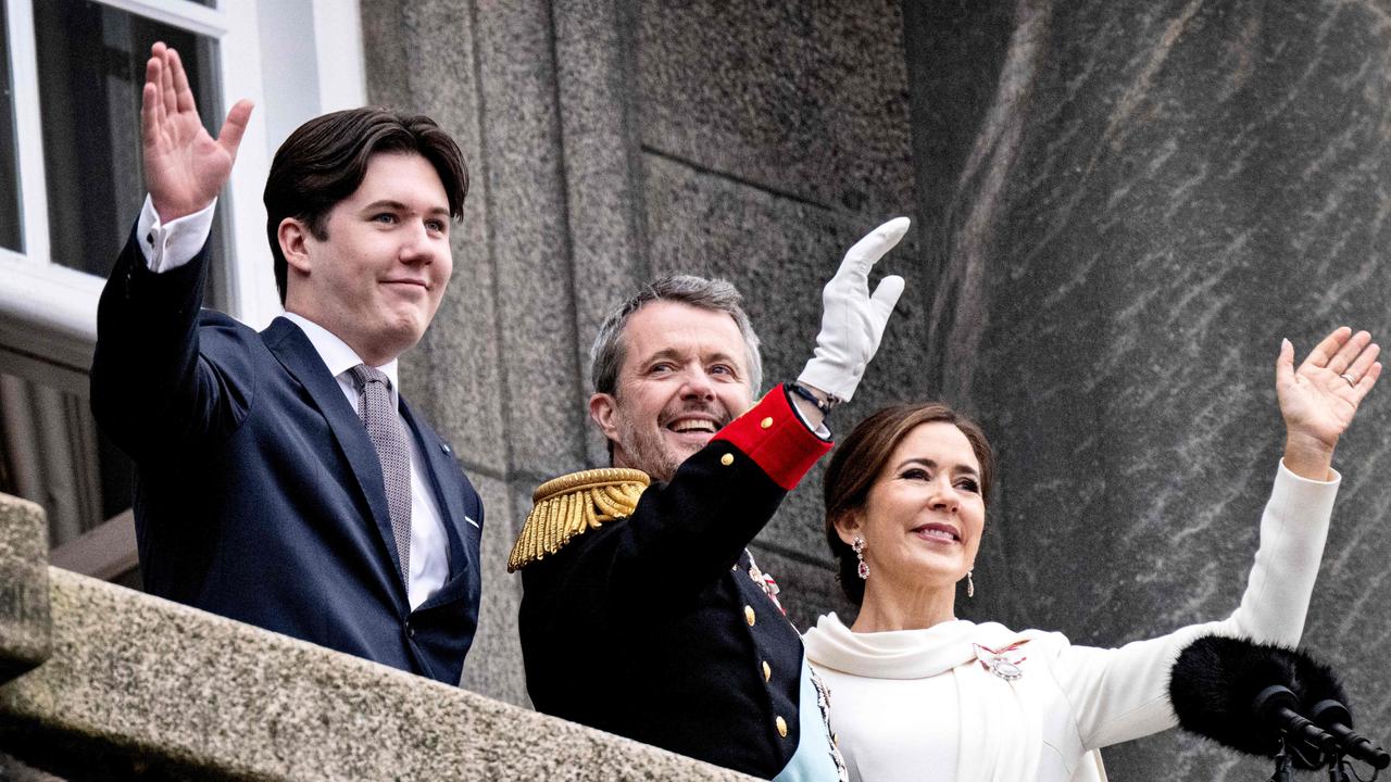 Crown Prince Christian, King Frederik X and Queen Mary of Denmark wave to the crowd after the a declaration of the King's accession to the throne. Picture: AFP.