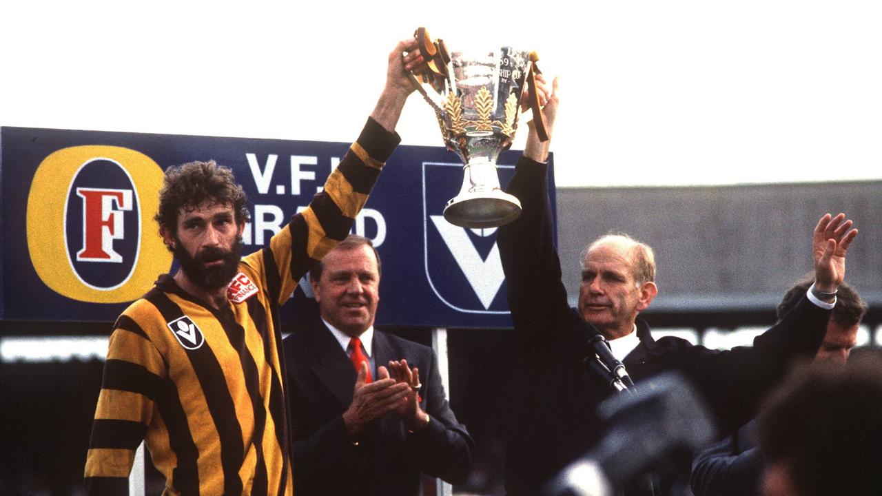 Michael Tuck and coach Allan Jeans lift the premiership cup in 1989.