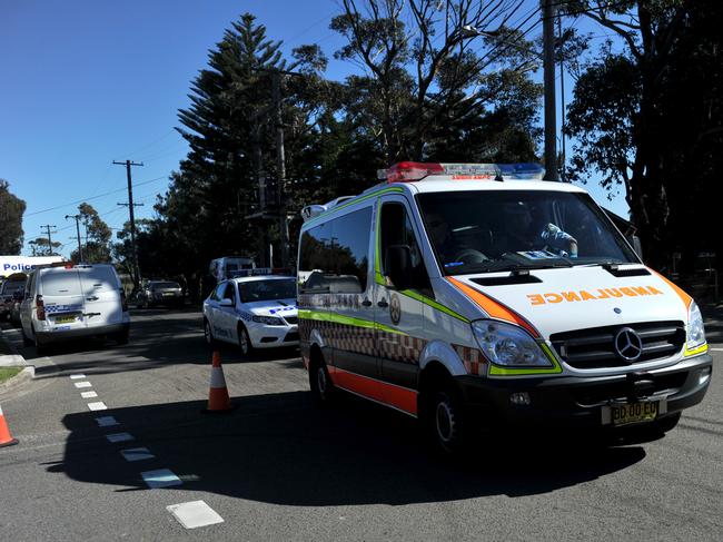 An ambulance carrying the man at the centre of a siege is taken to hospital after being shot by police in Kurnell, Sydney on Thursday, Aug. 16, 2012. Police surrounded a house after shots were fired earlier opposite a primary school in where an armed man was holed up. (AAP Image/Paul Miller) NO ARCHIVING