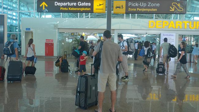 Tourists at Ngurah Rai International Airport in Bali. Picture: Adrian Suwanto