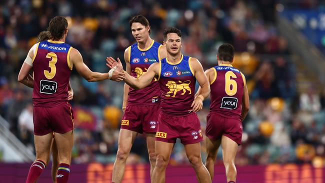 BRISBANE, AUSTRALIA – JUNE 14: Cam Rayner of the Lions celebrates a goal during the round 14 AFL match between Brisbane Lions and St Kilda Saints at The Gabba, on June 14, 2024, in Brisbane, Australia. (Photo by Chris Hyde/AFL Photos/via Getty Images)