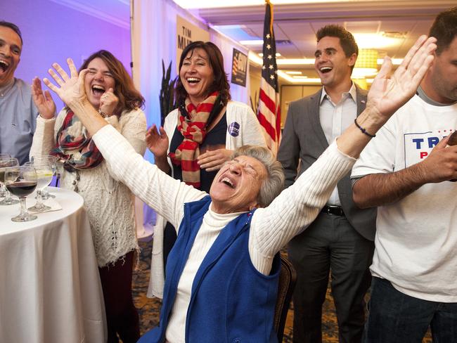 GOP supporter Georgia Touloumes, center, 86, of Venetia, Pa., shouts in joy surrounded by her family as more states are announced for Republican presidential candidate Donald Trump on early results on TV at Election Night Party of Congressman Tim Murphy and State Sen. Guy Reschenthaler at the Crowne Plaza in Bethel Park, a suburb of Pittsburgh on Tuesday, Nov. 8, 2016. (Stephanie Strasburg/Pittsburgh Post-Gazette via AP)