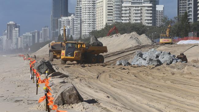 Earthmoving equipment on the sand at Narrowneck continue with their seawall works. Picture Glenn Hampson