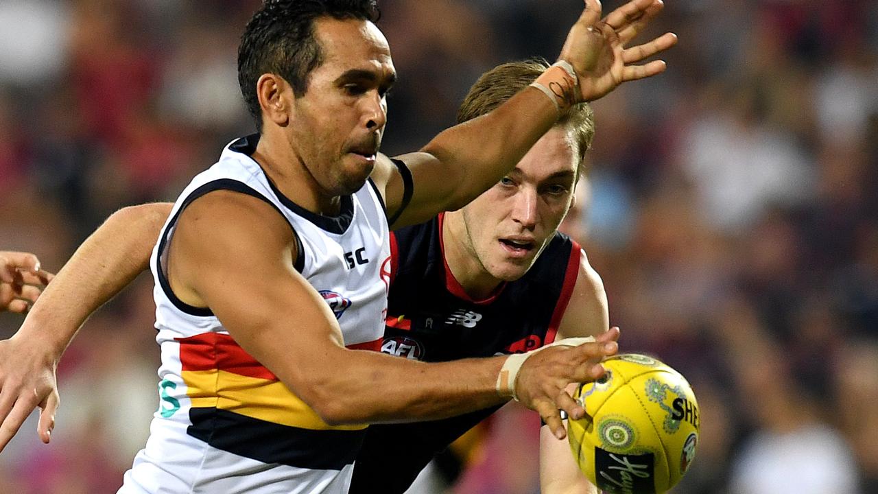 Eddie Betts of the Crows (left) in action during the Round 11 AFL match between the Melbourne Demons and the Adelaide Crows in Darwin. Picture: AAP