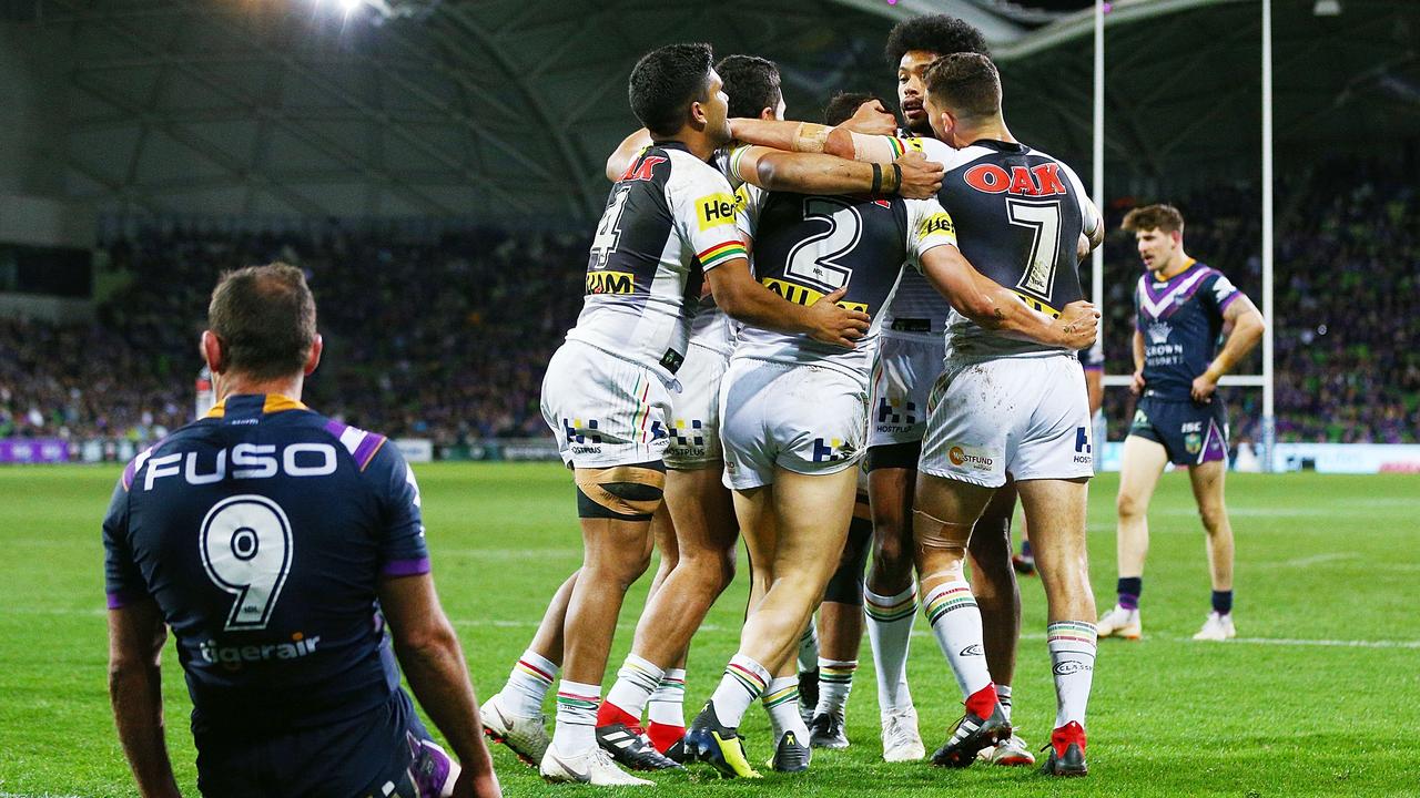 Panthers players celebrate after Josh Mansour scores a try.