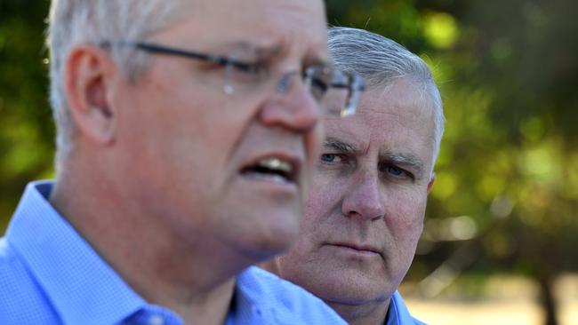 Deputy Prime Minister Michael McCormack (right) watches Prime Minister Scott Morrison speak at a press conference at Eumungerie Farm, north of Dubbo, earlier this year. Picture: AAP