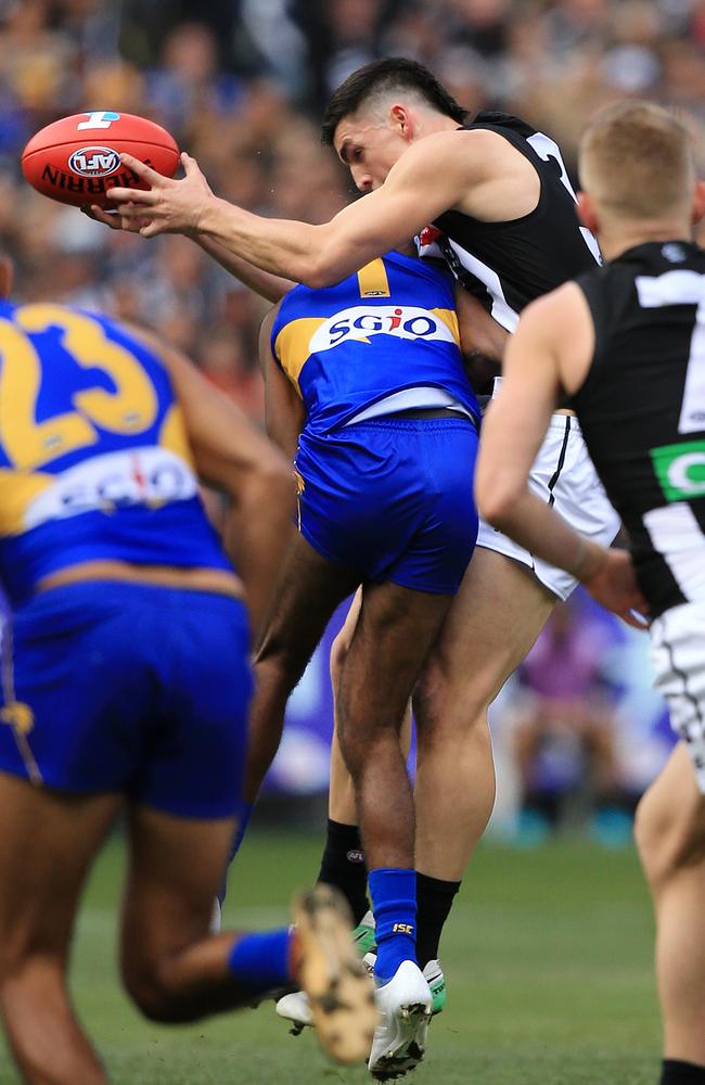 Liam Ryan lays a bone-crunching bump on Brayden Maynard. Picture: Mark Stewart