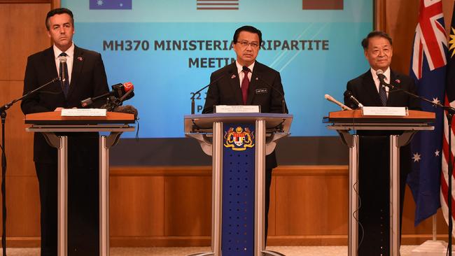 Malaysia's Transport Minister Liow Tiong Lai (C), Chinese Minister of Transport Yang Chuantang (R) and Australia's Minister for Infrastructure and Transport Darren Chester (L) listen to questions during a joint press conference of the Ministerial Tripartite Meeting on the search for missing Malaysia Airlines flight MH370 at the Malaysian federal administrative centre in Putrajaya, outside Kuala Lumpur on June 22, 2016. Hopes of finding flight MH370's final resting place are "fading", and the three-nation search will be suspended if nothing is found in the suspected crash zone, Malaysia, Australia and China announced on July 22. / AFP PHOTO / MOHD RASFAN