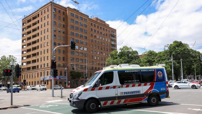 MELBOURNE, AUSTRALIA - NewsWire Photos 18 JANUARY 2022 : VictoriaÃs hospital system is under extreme pressure due to the covid-19 Omicron variant and a ÃCode brownÃ has been enforced.This will enable hospitals to cancel their staffs leave to ensure an adequate workforce is on hand. An ambulance passes St VincentÃs Hospital. Picture : NCA NewsWire / Ian Currie