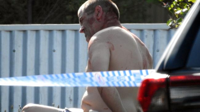 Mark John Walters, 48, during his arrest after Gavin Thomas Greene was allegedly stabbed on Mr Walters’ front porch. Picture: Supplied