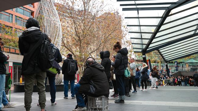 People queuing outside Sydney Passport Office at Henry Deane Plaza, on Monday. Picture: Justin Lloyd