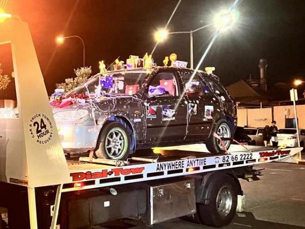 A grey Mazda Astina - decked out with Christmas lights and large ornaments -  was being driven on the footpath and restricted area at Henley Square. Picture: SA Police