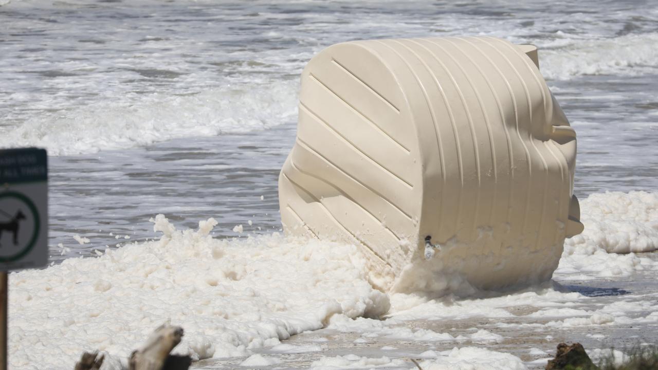 A water tank washed up on Sharpes Beach at Skennars Head, north of Ballina, during flooding on Wednesday. Picture: Liana Boss