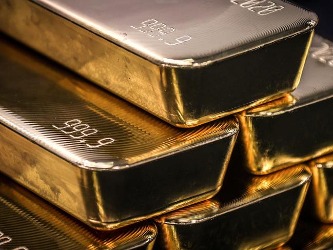 TOPSHOT - Gold bullion bars are pictured after being inspected and polished at the ABC Refinery in Sydney on August 5, 2020. - Gold prices hit 2,000 USD an ounce on markets for the first time on August 4, the latest surge in a commodity seen as a refuge amid economic uncertainty. (Photo by DAVID GRAY / AFP)