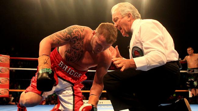 Paul Briggs goes down for the count after one blow from Danny Green during their IBO cruiserweight title bout.