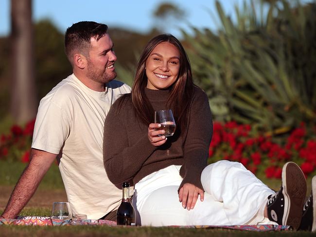 Newly coupled Layla Hfaid, 21, and Kell O’Brien, 25, have been dating for a few months and equally enjoy a low cost picnic in the park as to an expensive meal out. Reports of the increasing cost of dating are putting people off looking for love or turning to low-cost date options. Picture: Jane Dempster/The Daily Telegraph.