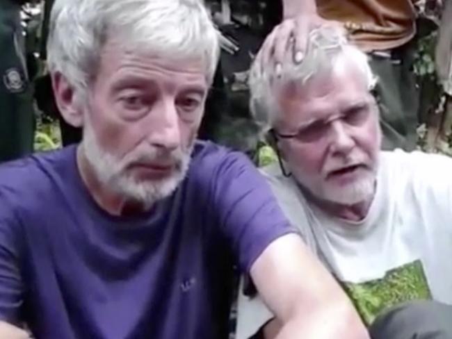 Robert Hall, left, and John Ridsdel, right, held and eventually killed by Muslim militants Abu Sayyaf. Picture: militant video via AP