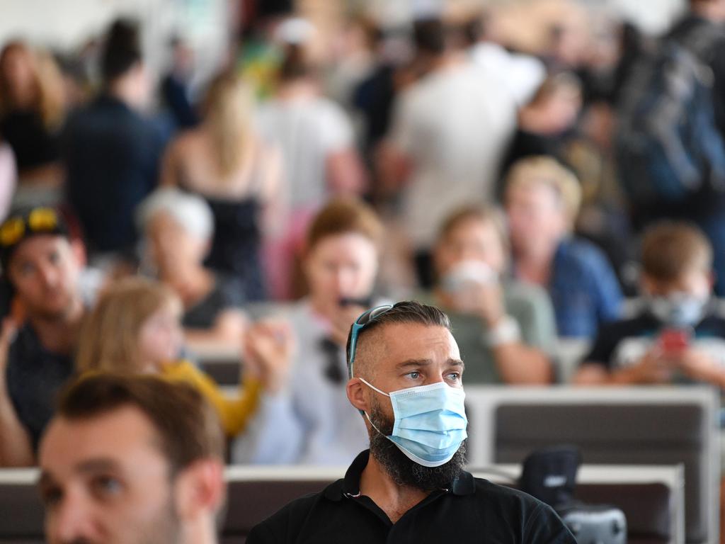 People are seen waiting for flights at Adelaide Airport. Picture: NCA NewsWire / David Mariuz