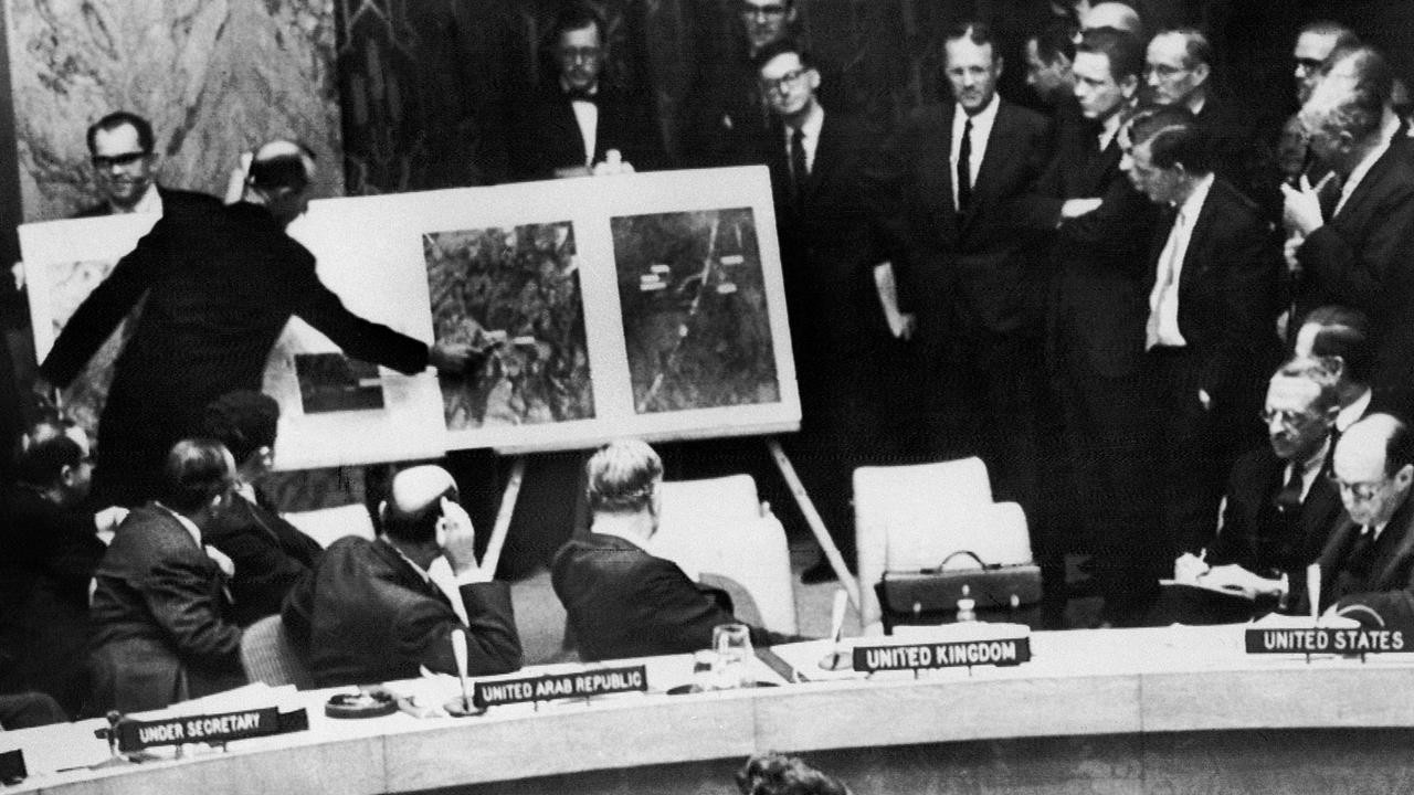 A US administration official shows aerial views of one of the Cuban medium-range missile bases to the members of the United Nations Security Council.