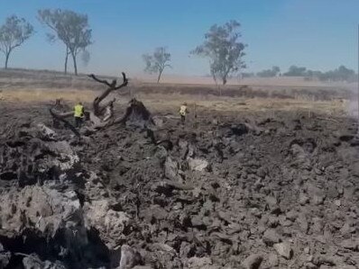 A screenshot from a video showing the aftermath of a fatal crash on the Bruce Highway at Bororen on Friday, when a truck carrying ammonium nitrate collided with a ute. Source: Supplied