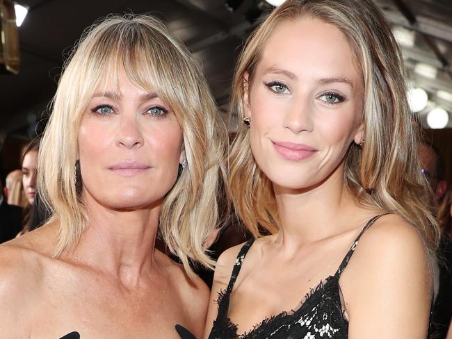 LOS ANGELES, CA - SEPTEMBER 17:  Actor Robin Wright (L) and Dylan Penn walk the red carpet during the 69th Annual Primetime Emmy Awards at Microsoft Theater on September 17, 2017 in Los Angeles, California.  (Photo by Rich Polk/Getty Images for IMDb)