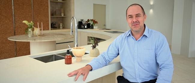 Colliers residential director Daniel Hirst pictured at the Paloma Paloma display site on Bulcock St. The kitchens would feature concrete bench tops and cork cupboards. Picture: Tegan Annett