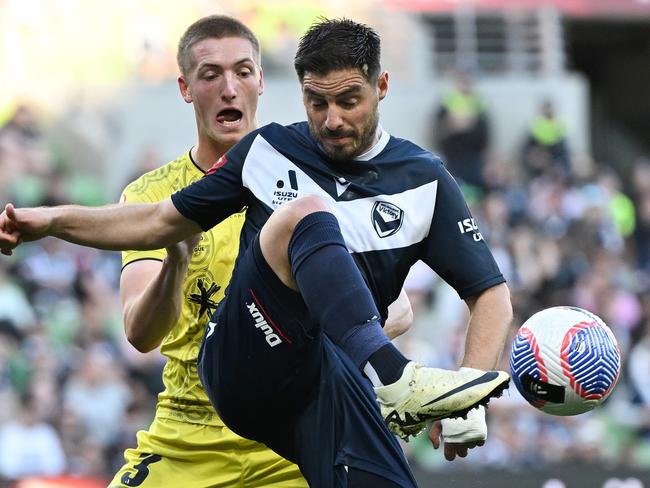 MELBOURNE, AUSTRALIA - MAY 12: Bruno Fornaroli of the Victory controls the ball under pressure from Finn Surman of the Phoenix during the A-League Men Semi Final match between Melbourne Victory and Wellington Phoenix at AAMI Park, on May 12, 2024, in Melbourne, Australia. (Photo by Daniel Pockett/Getty Images)