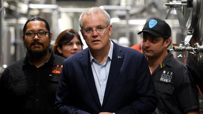 Prime Minister Scott Morrison’s media strategy involves surrounding himself with workers. Picture: AAP