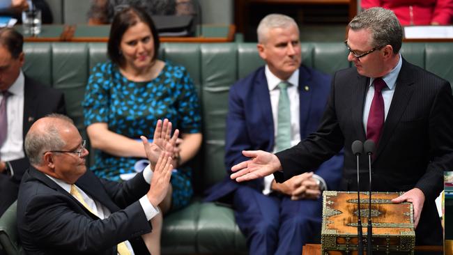 Prime Minister Scott Morrison (left) defers to Leader of the House Christopher Pyne (right) during Question Time in the House of Representatives at Parliament House in Canberra yesterday. Picture: AAP