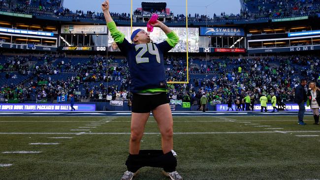 A Seattle Seahawks fan celebrates after the Seahawks defeated the Green Bay Packers.