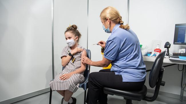 Romy Vickers, 13, gets her first Pfizer vaccination from nurse Robyn Buis. PICTURE: Brad Fleet