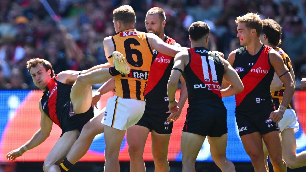 James Sicily kicking Andrew McGrath at the MCG. (Photo by Quinn Rooney/Getty Images)