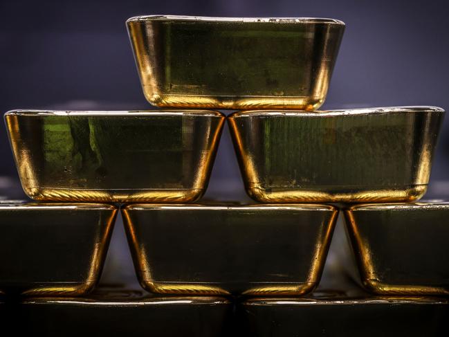 Gold bullion bars are pictured after being inspected and polished at the ABC Refinery in Sydney on August 5, 2020. - Gold prices hit 2,000 USD an ounce on markets for the first time on August 4, the latest surge in a commodity seen as a refuge amid economic uncertainty. (Photo by DAVID GRAY / AFP)