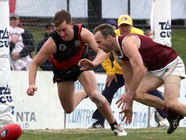 Michael Still fights for possession during this year’s NFL Division 2 decider.