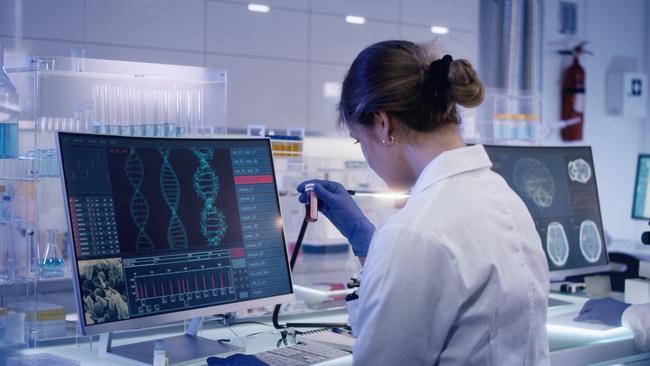 A scientists examines a DNA model. Picture: iStock