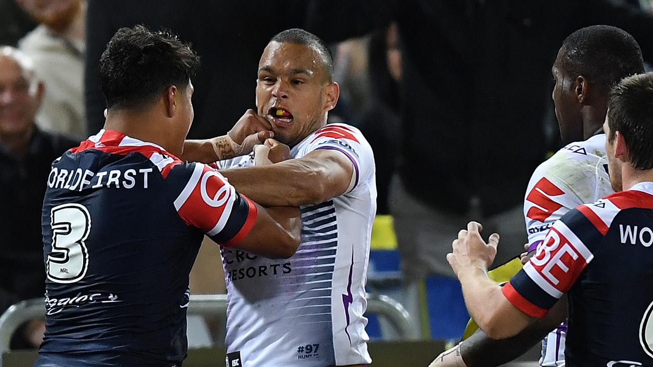 Latrell Mitchell and Will Chambers have a fierce rivalry on the park. (AAP Image/Joel Carrett) 