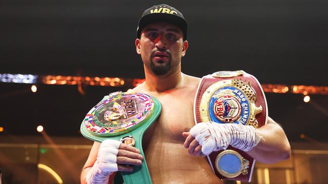 Agit Kabayel poses for a photo with his belts. Photo by Richard Pelham/Getty Images)