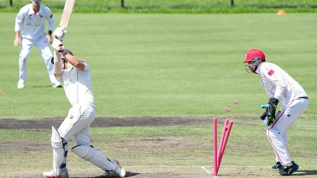 Bonbeach’s Jack Bailey is bowled by Mordialloc’s Jordan Barden. Picture: George Sal