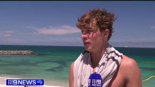 Shark trapped INSIDE the shark net at popular perth beach.