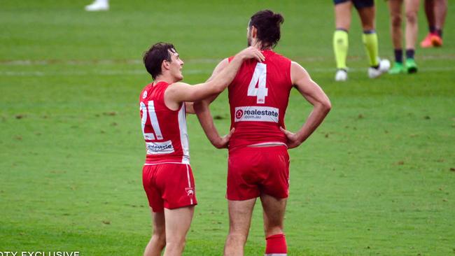 Swan Errol Gulden checks in on Brodie Grundy mid-game. Photo: Fox Footy.